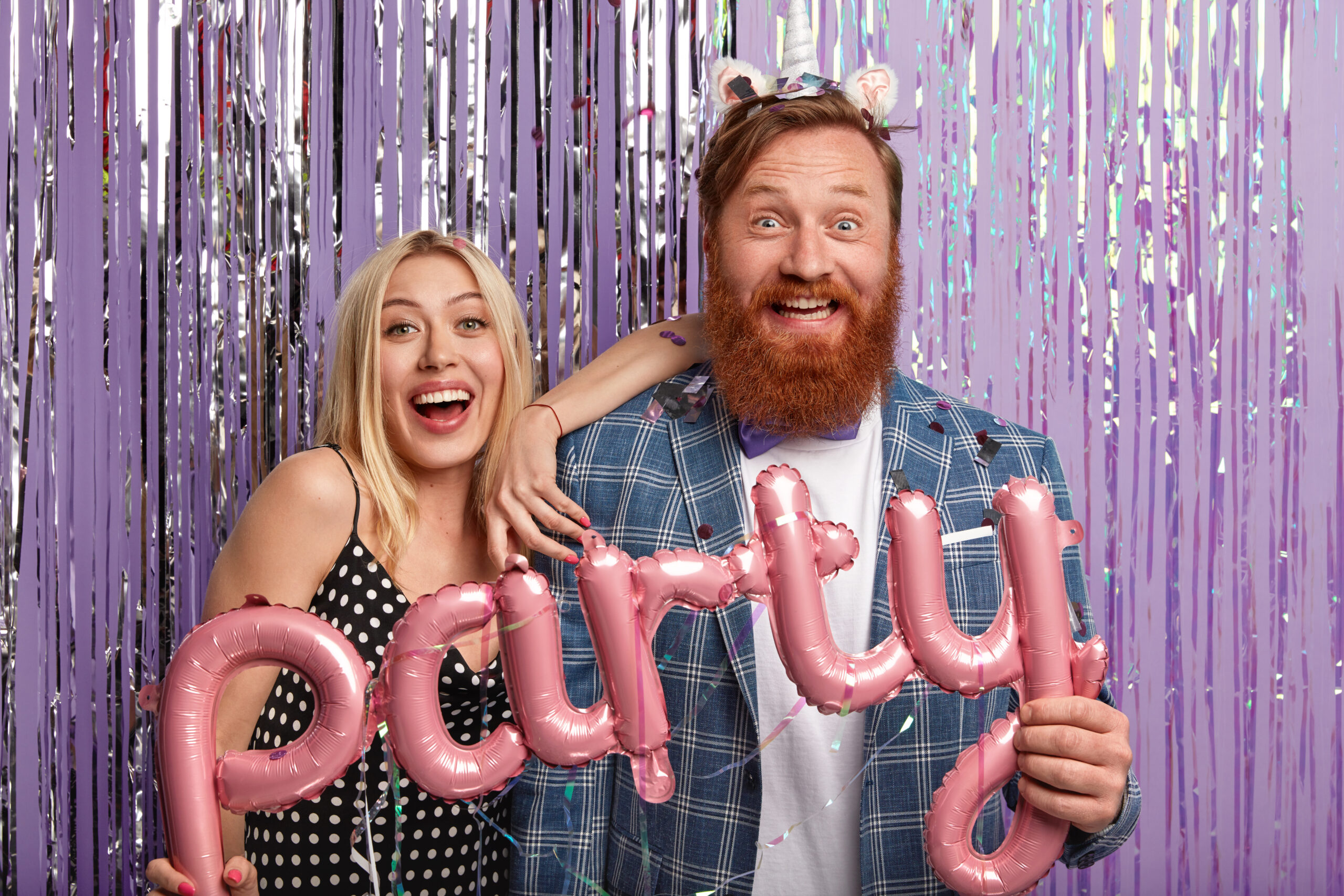 joyous-couple-stand-each-other-have-fun-indoor-pose-decorated-photozone